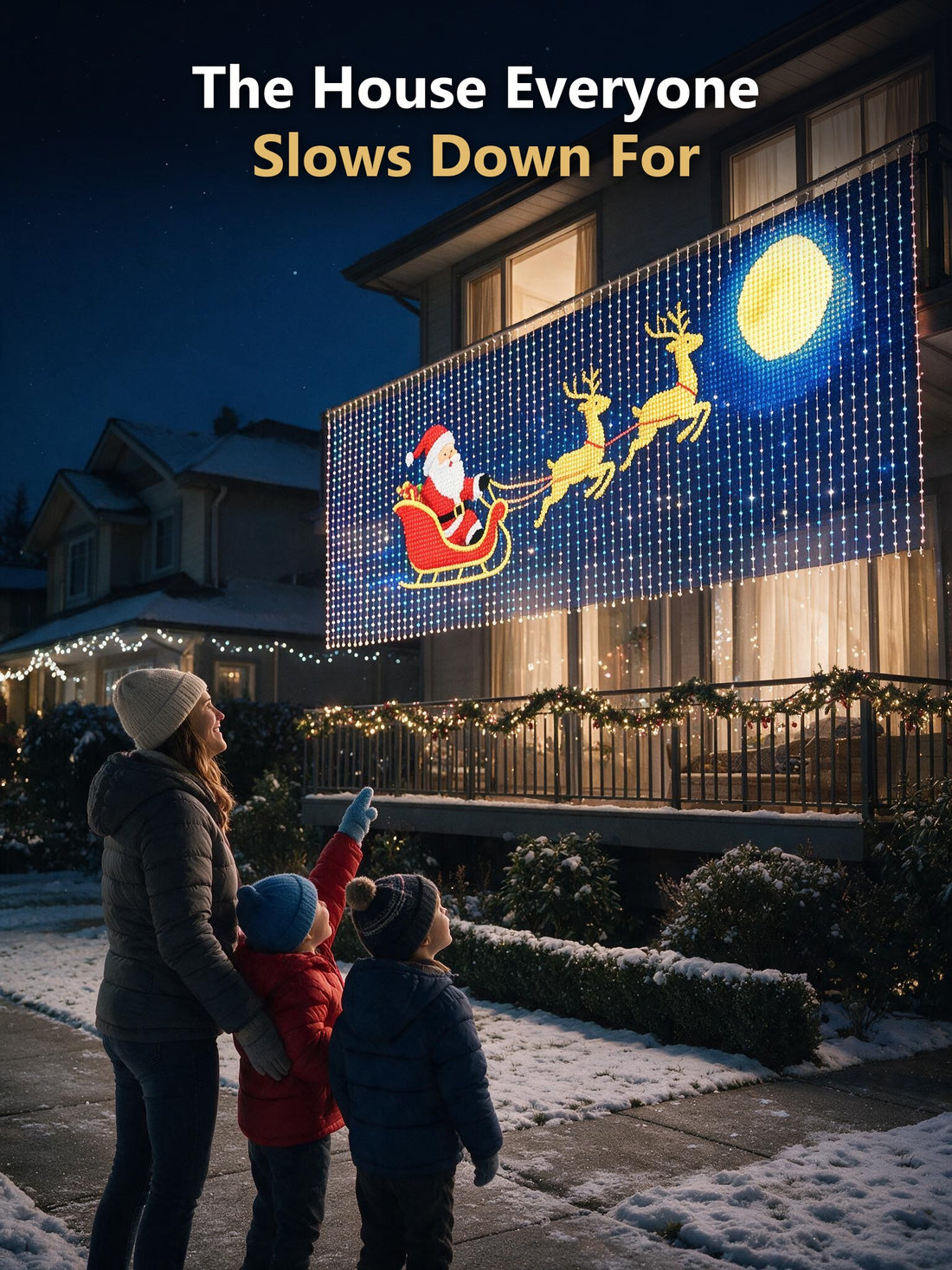 Kids pointing at the Santa sleigh display on a balcony